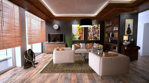 Warmly decorated living room with wooden Venetian blinds Glasgow partly covering windows on the left wall.