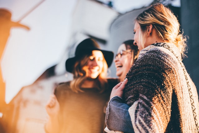 three friends laughing